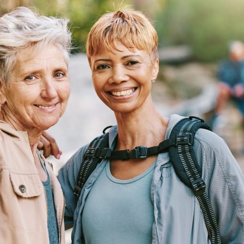 Elderly women, smile and hiking with fitness outdoor, trekking with friends and retirement, vitalit