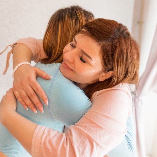 Women Friendship.two women hugging each other smiling. energizing during. Happy people