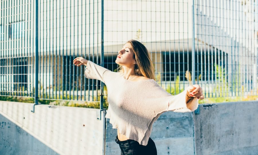 Young millennial woman feeling free outdoor