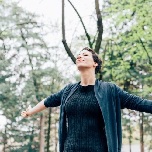 Young woman outdoor feeling free